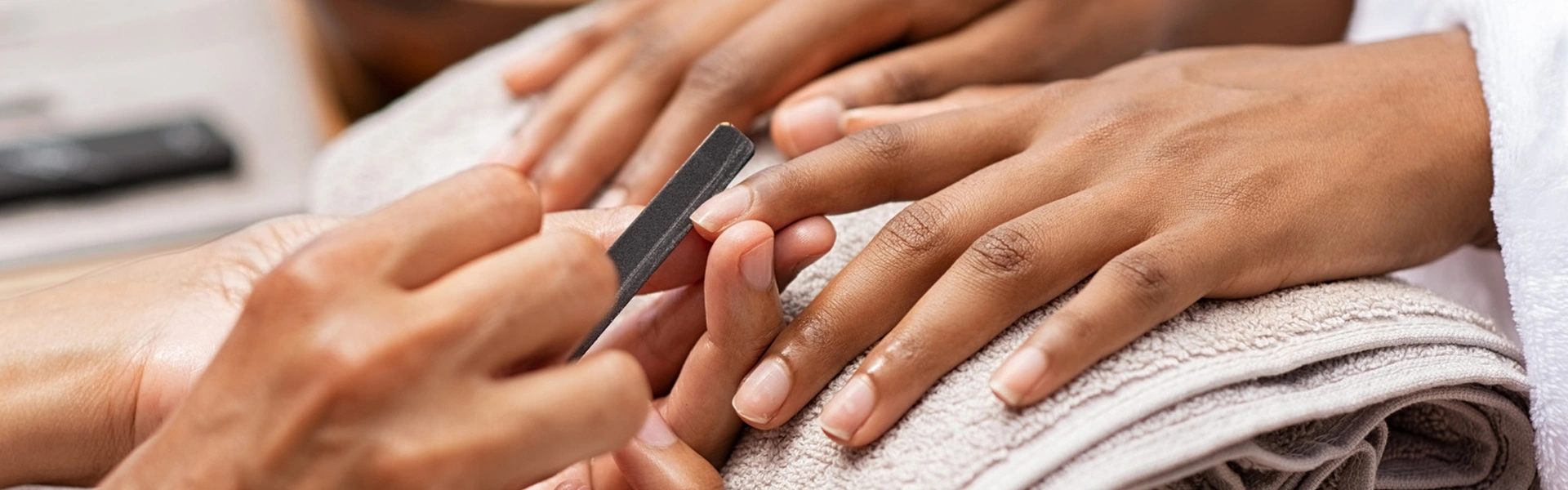 Professional natural nail shaping and therapeutic manicure treatment at Jada Nail Clinic.